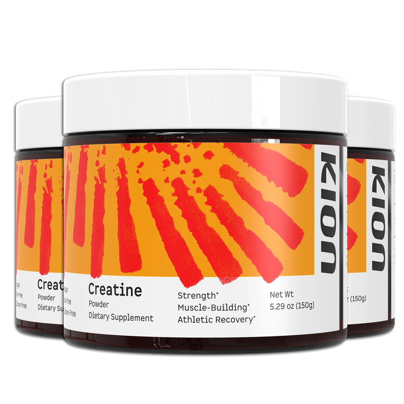 Three tubs of Kion Creatine Powder with orange-and-red labels and white lids, shown in a stacked product display.