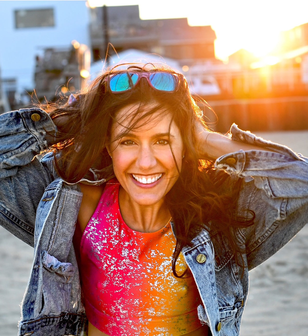 Christine Bibboherr smiling on the beach at sunset