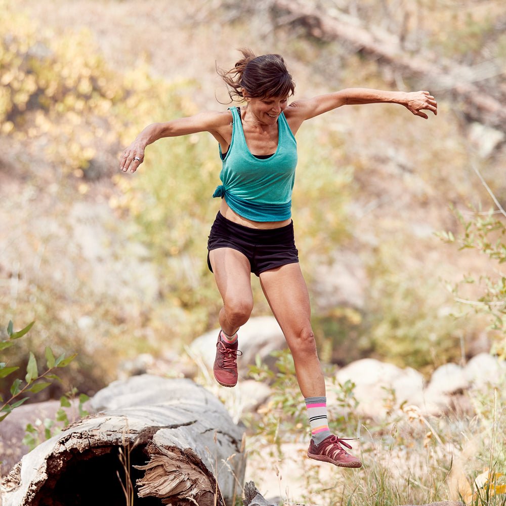 Woman running on an outdoor trail
